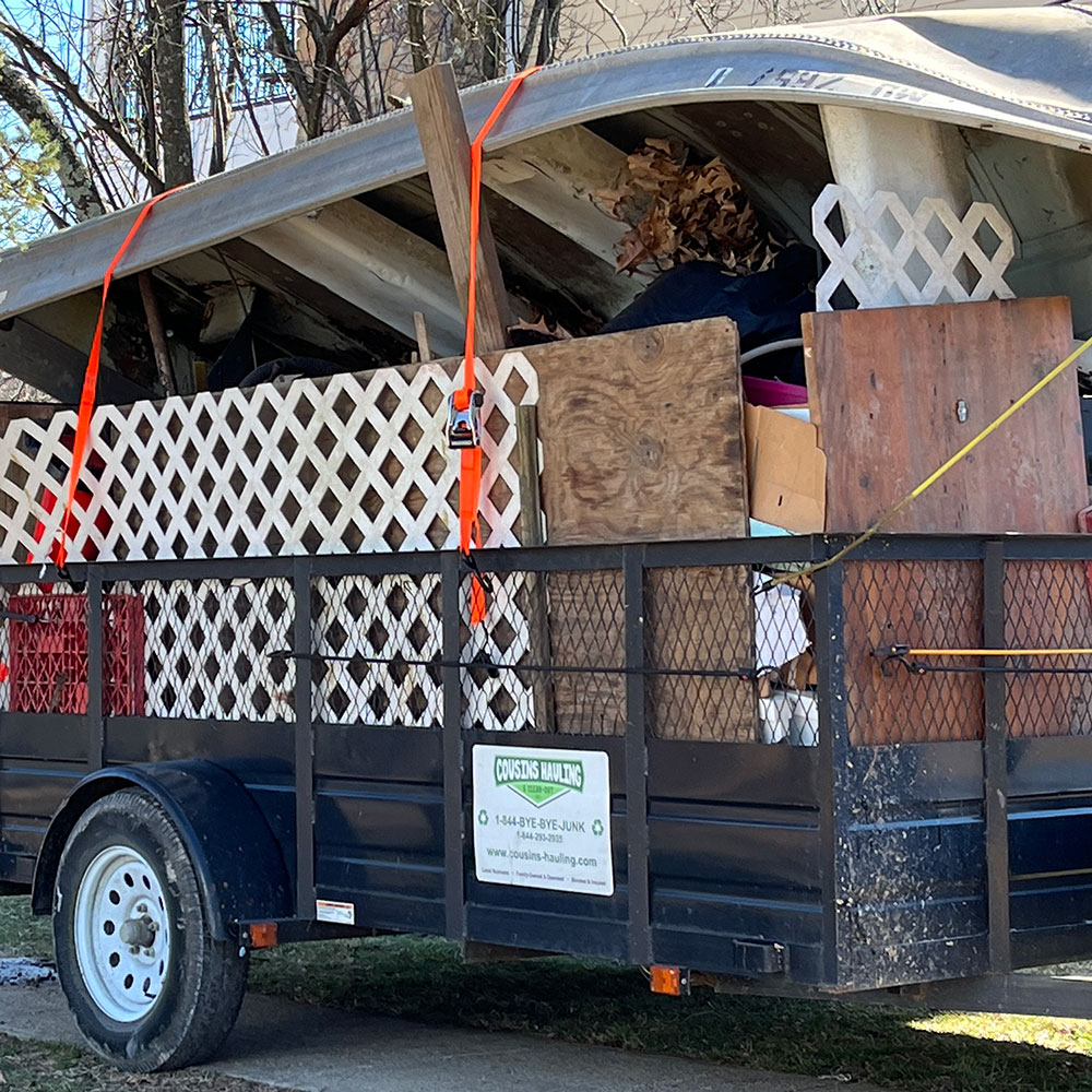 Trailer containing a boat and fencing